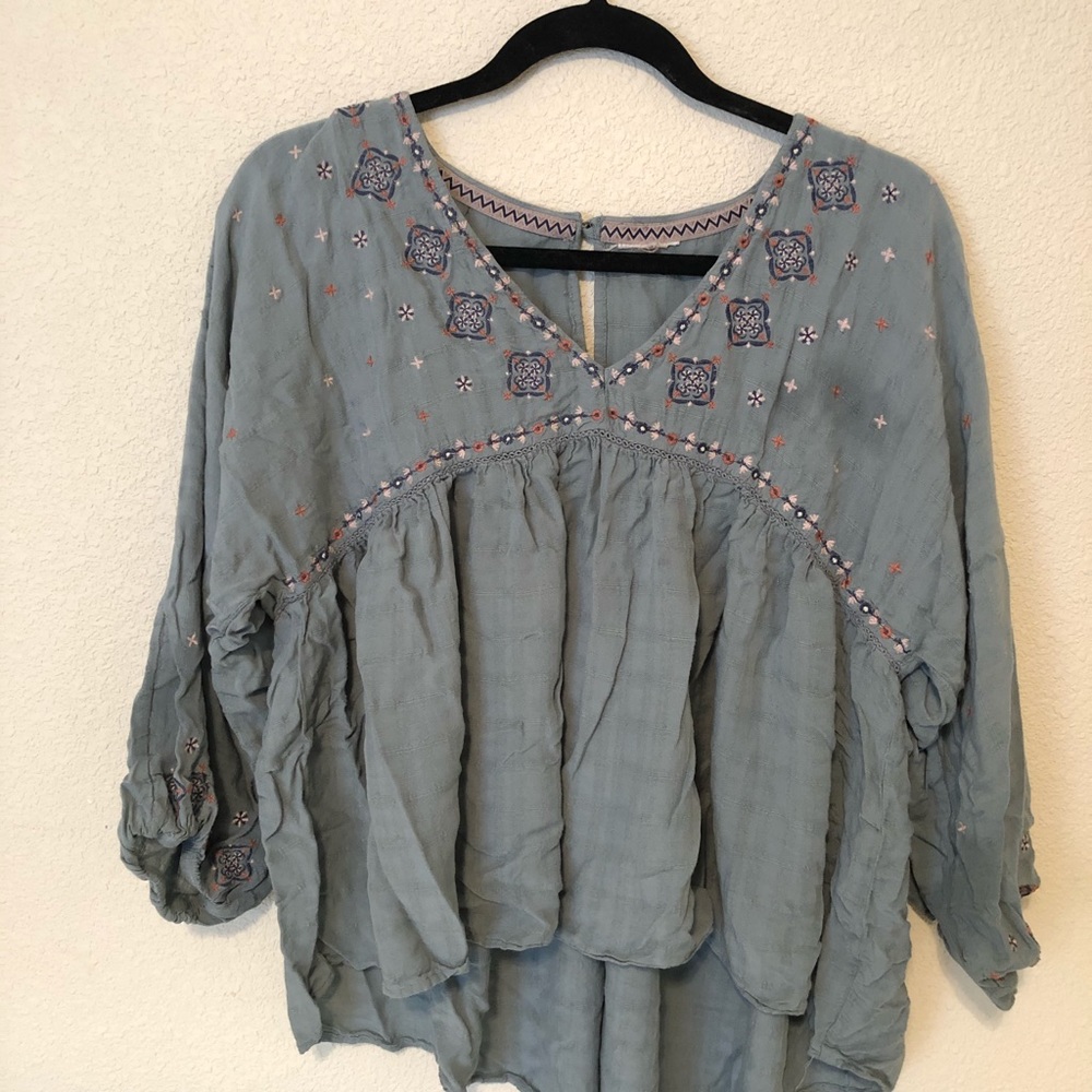 light blue flowy shirt